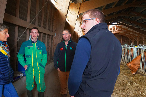 Members of the PAI visit Albert Privat and his son Pierre, who is getting his farm set up